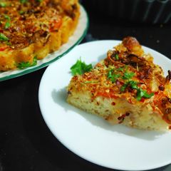 A picture of Quick Foccasia with Caramelised onion and tomato.