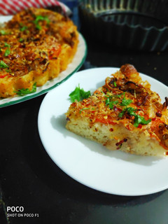 A picture of Quick Foccasia with Caramelised onion and tomato.