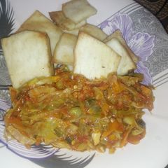 A picture of Fried yam with cabbage sauce.