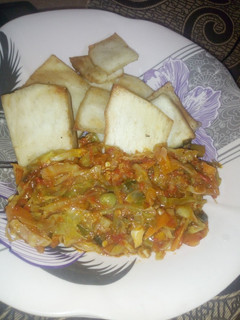 A picture of Fried yam with cabbage sauce.