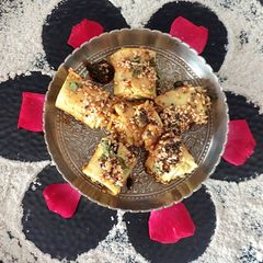 JOWAR FLOUR KHANDVI in microwave oven A picture of JOWAR FLOUR KHANDVI in microwave oven.