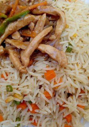 A picture of Coconut fried rice with shredded chicken sauce.