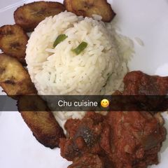 A picture of White rice, meaty tomato stew and fried plantain.