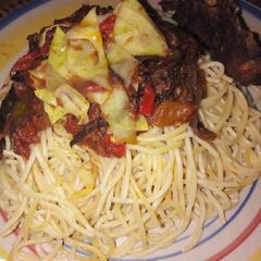 A picture of Pasta and delicious dried fish sauce.
