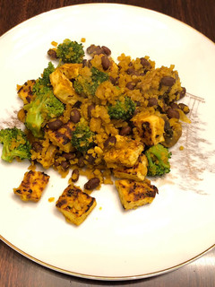 A picture of Cauliflower Yellow Rice with Black Bean,Tofu,and Broccoli 🥦.
