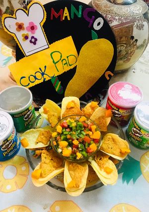 A picture of Fresh mango 🥭 salsa with prinkles(chips).