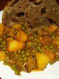 Beef stew with potatoes and green peas