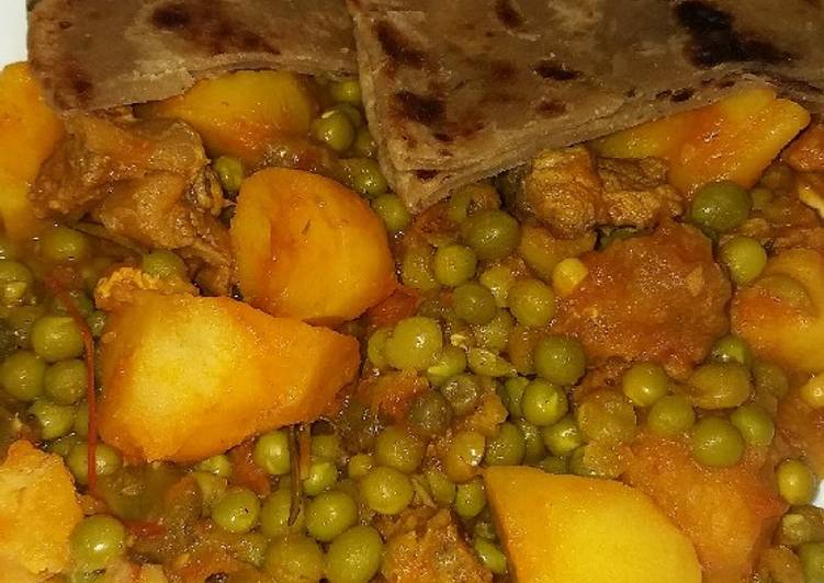 Beef stew with potatoes and green peas