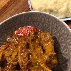 A picture of Lamb / Beef in Palm creme sauce with FuFu.