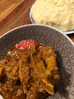 A picture of Lamb / Beef in Palm creme sauce with FuFu.