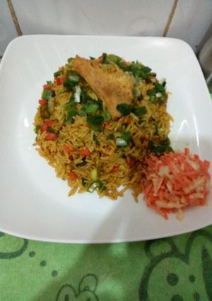 A picture of Fried rice with side coleslaw.