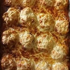 A picture of Chicken arrabbiata stew with parmesan dumplings.