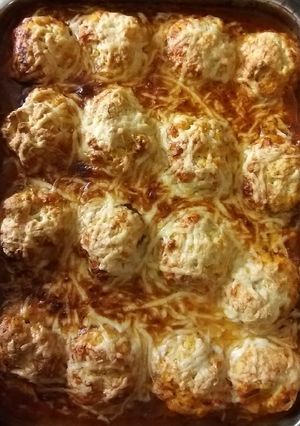 A picture of Chicken arrabbiata stew with parmesan dumplings.