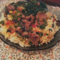 A picture of Boiled Rice +Stewed beef +Sautéed Kales.