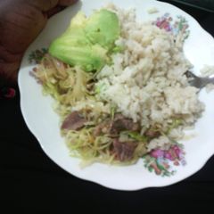 A picture of Boiled rice served with cabbage mixed with meat.