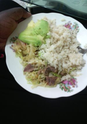 A picture of Boiled rice served with cabbage mixed with meat.