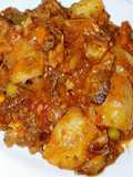 Potatoes mixed with peas and beef