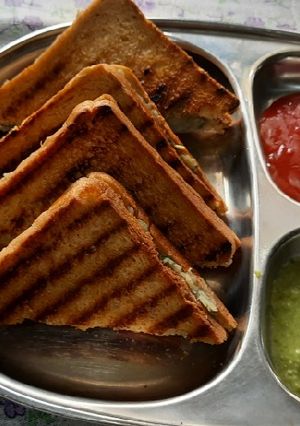 A picture of Brown bread Potato stuff peanuts butter grilled sandwich.