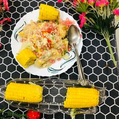 A picture of Vegetable Corn cheese in white sauce.