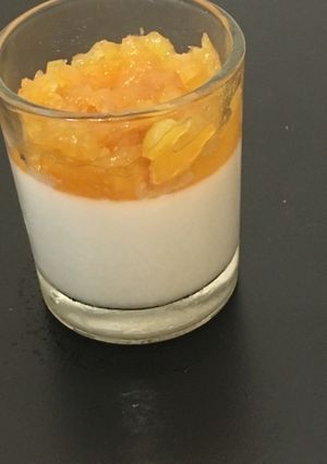 A picture of Coconut panna cotta with pineapple glaze.