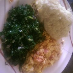 A picture of Mayai sukuma served with ugali.