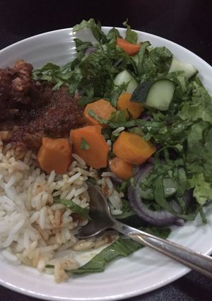 A picture of White rice and salad.