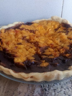 Una foto de Tarta de duraznos y chocolate 🍑🍫