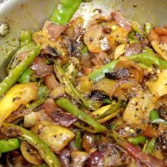 A picture of Onion and raw mango veg.