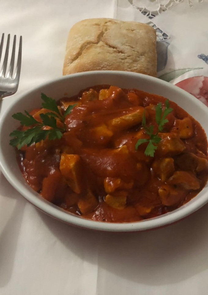 Una foto de Magro de cerdo con tomate