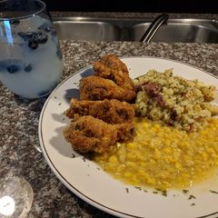 Fried honey 🍊 chicken drummetes and parsley potatoes with corn A picture of Fried honey 🍊 chicken drummetes and parsley potatoes with corn.