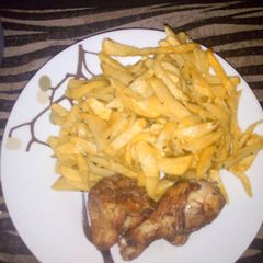 A picture of Chips and deep fried chicken.