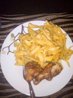 A picture of Chips and deep fried chicken.