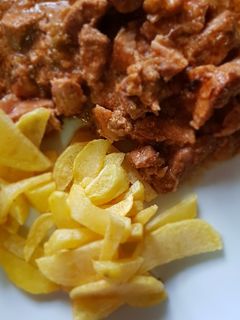 Una foto de Carne de cerdo en salsa en olla gm D
