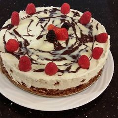 A picture of White Chocolate Mousse Cheesecake with a Fudge Brownie Crust.
