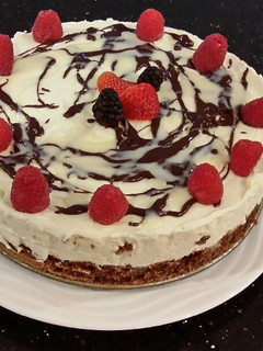 A picture of White Chocolate Mousse Cheesecake with a Fudge Brownie Crust.