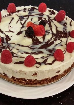 A picture of White Chocolate Mousse Cheesecake with a Fudge Brownie Crust.