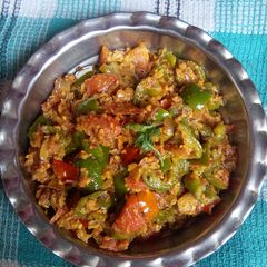 A picture of Tomato capsicum sabji.