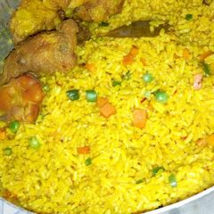 A picture of Fried rice and Chicken.