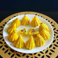 A picture of Modak stuffed with dates and dryfruits.