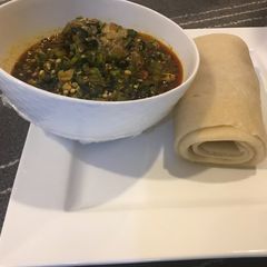 A picture of Semo with fresh okra soup.