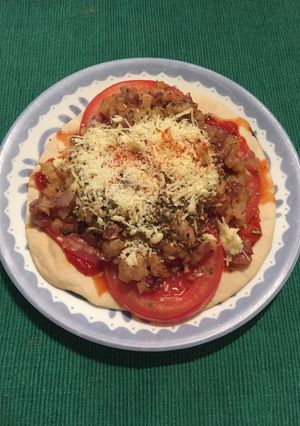 Una foto de Pizzetta de chicharrón de camarones al ajillo con cerveza