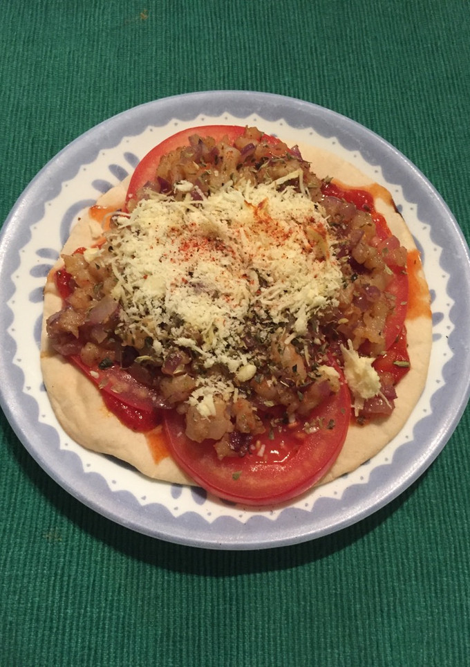 Una foto de Pizzetta de chicharrón de camarones al ajillo con cerveza