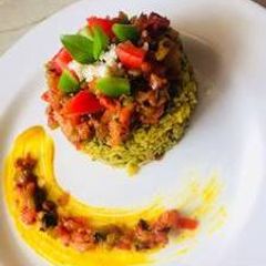 A picture of Spinach rice with tomato basil salsa.