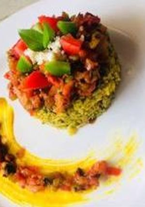 A picture of Spinach rice with tomato basil salsa.