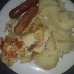 A picture of Smashed Irish Potato in butter.