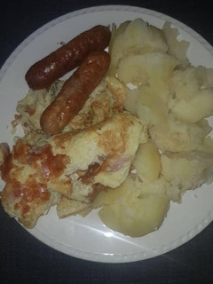 A picture of Smashed Irish Potato in butter.