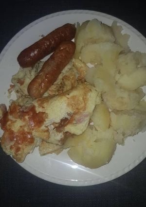A picture of Smashed Irish Potato in butter.