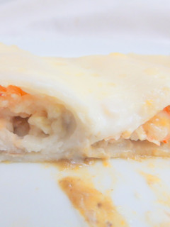 Una foto de Canelones de pescado al culis de boletus y parmesano