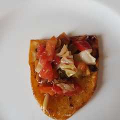 Una foto de Patatas al horno con pisto