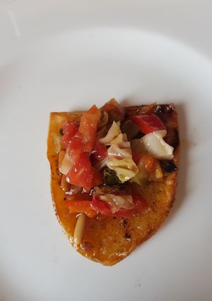 Una foto de Patatas al horno con pisto